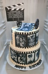 2 Tier eggless chocolate 90th birthday film theme cake