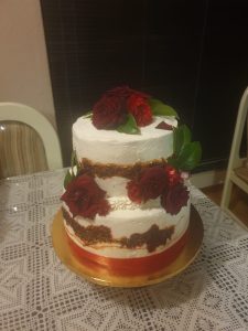 2 tier wedding cake with fresh cream and organic black magic roses