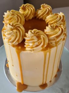 Extra tall Vanilla and baked cheesecake with salted caramel drip celebration cake