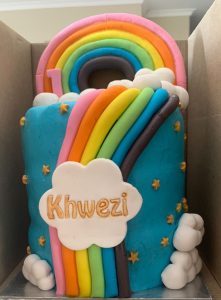 Kiddies rainbow theme birthday cake