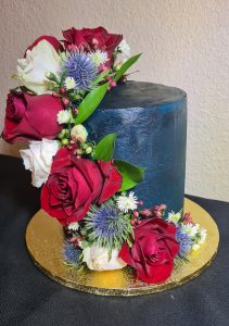 Navy blue and fresh flowers celebration cake