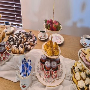 Strawberries, cupcakes, chocolate croissants and scones display