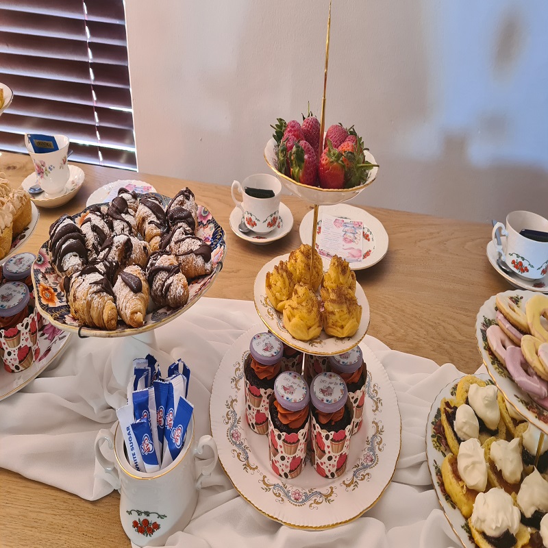 Strawberries, cupcakes, chocolate croissants and scones display