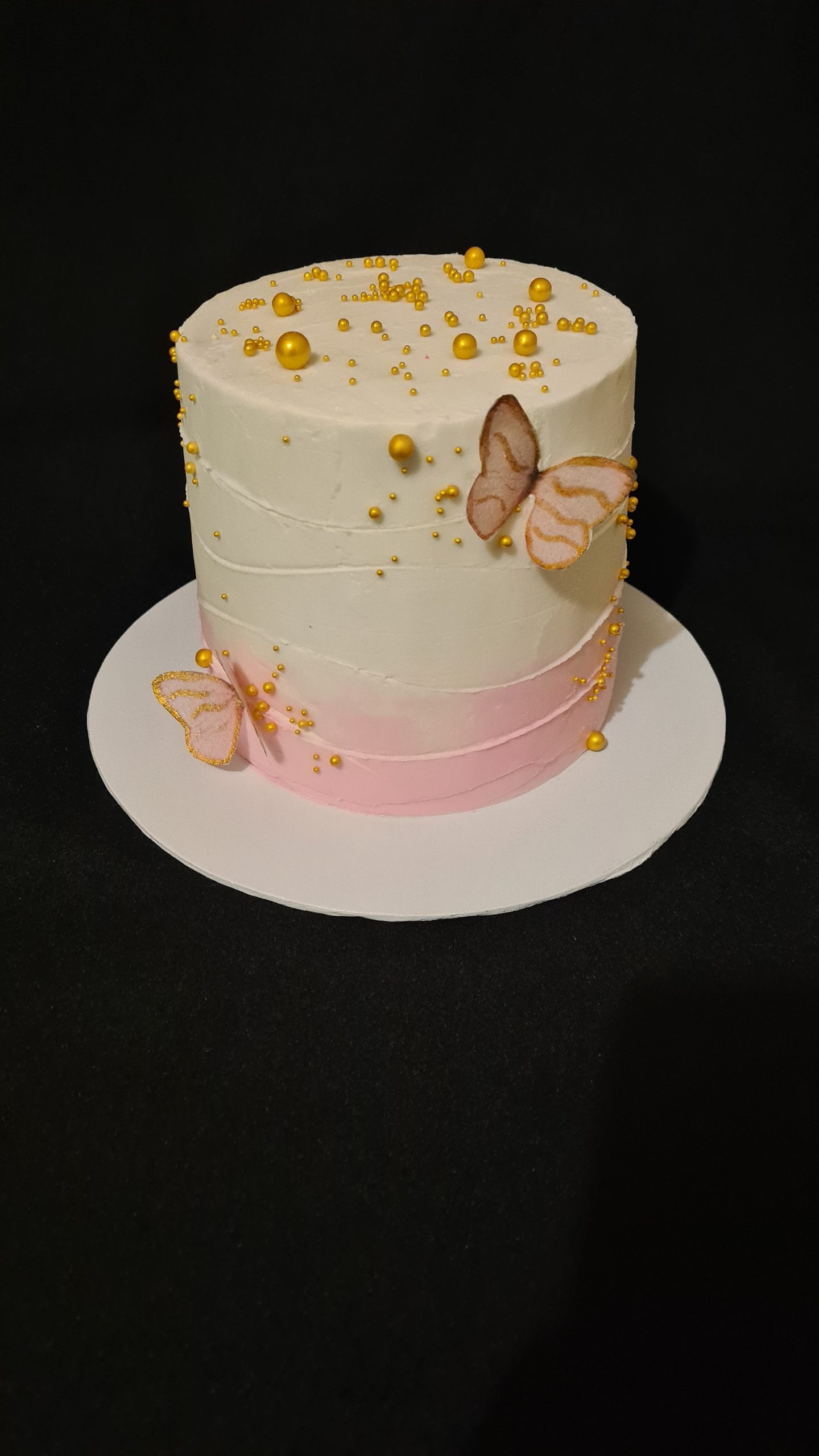 White and pink butterflies birthday cake