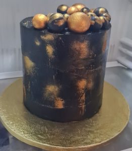 Black and gold birthday cake