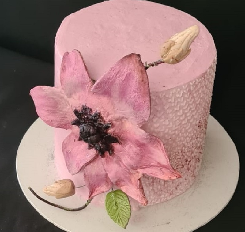 Pink birthday cake with giant edible flower
