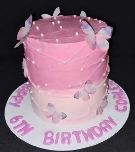 Pink butterflies and pearl birthday cake