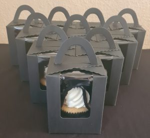 Individually boxed black and white theme birthday cupcakes