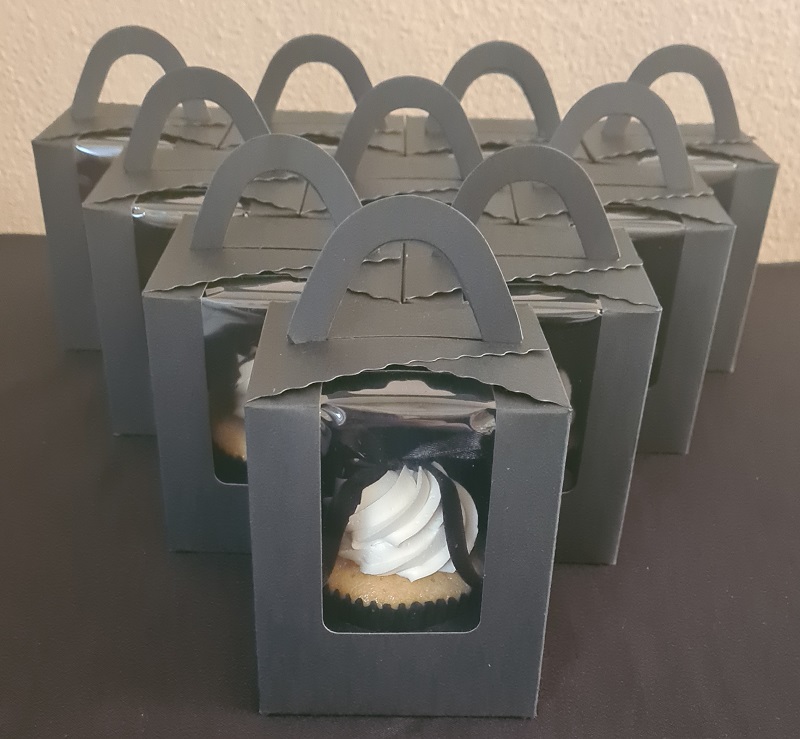 Individually boxed black and white theme birthday cupcakes