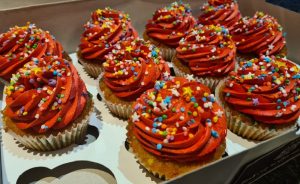 Vanilla cupcakes with orange icing