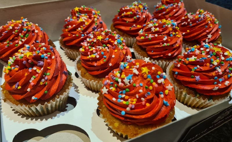 Vanilla cupcakes with orange icing